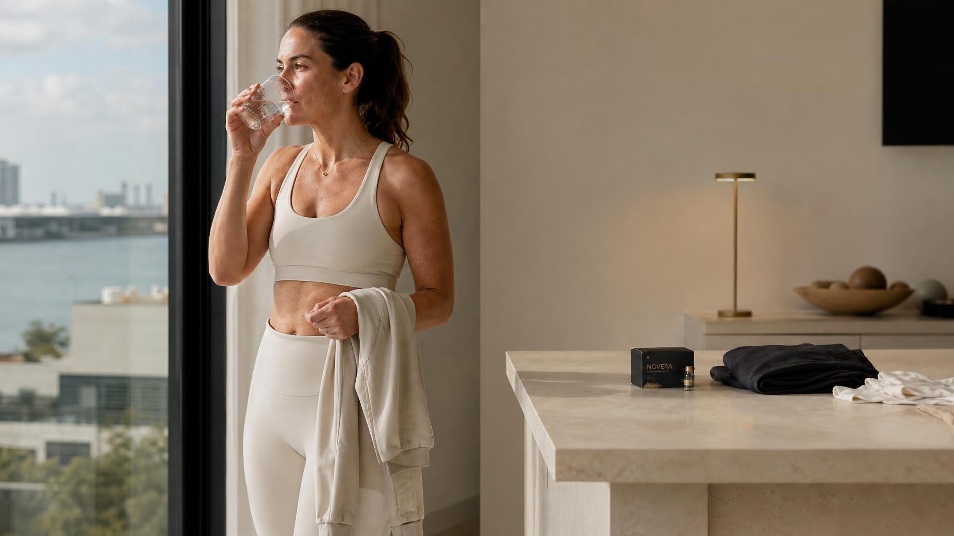 A person moving through a calm morning routine with Novera Retatrutide packaging placed nearby.
